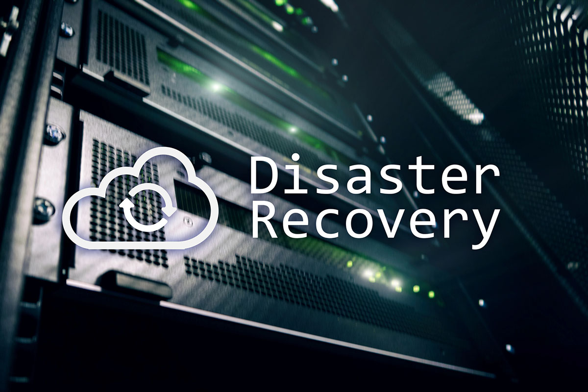 A close-up view of server racks with glowing green lights alongside the text "Disaster Recovery" and a cloud icon featuring a circular arrow.